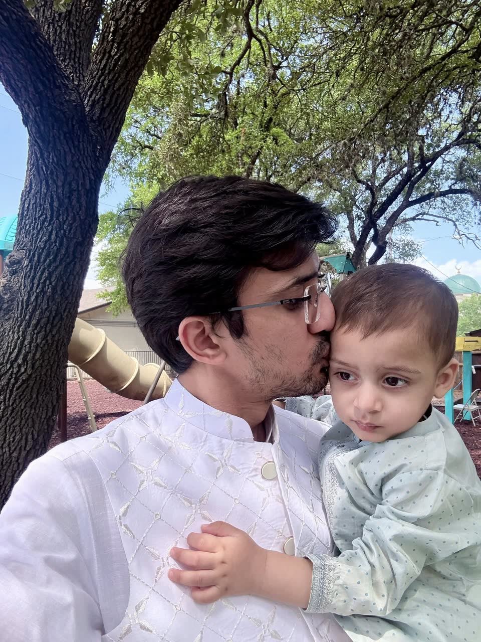 Umair kissing Raahim on Eid in Austin, June 2025