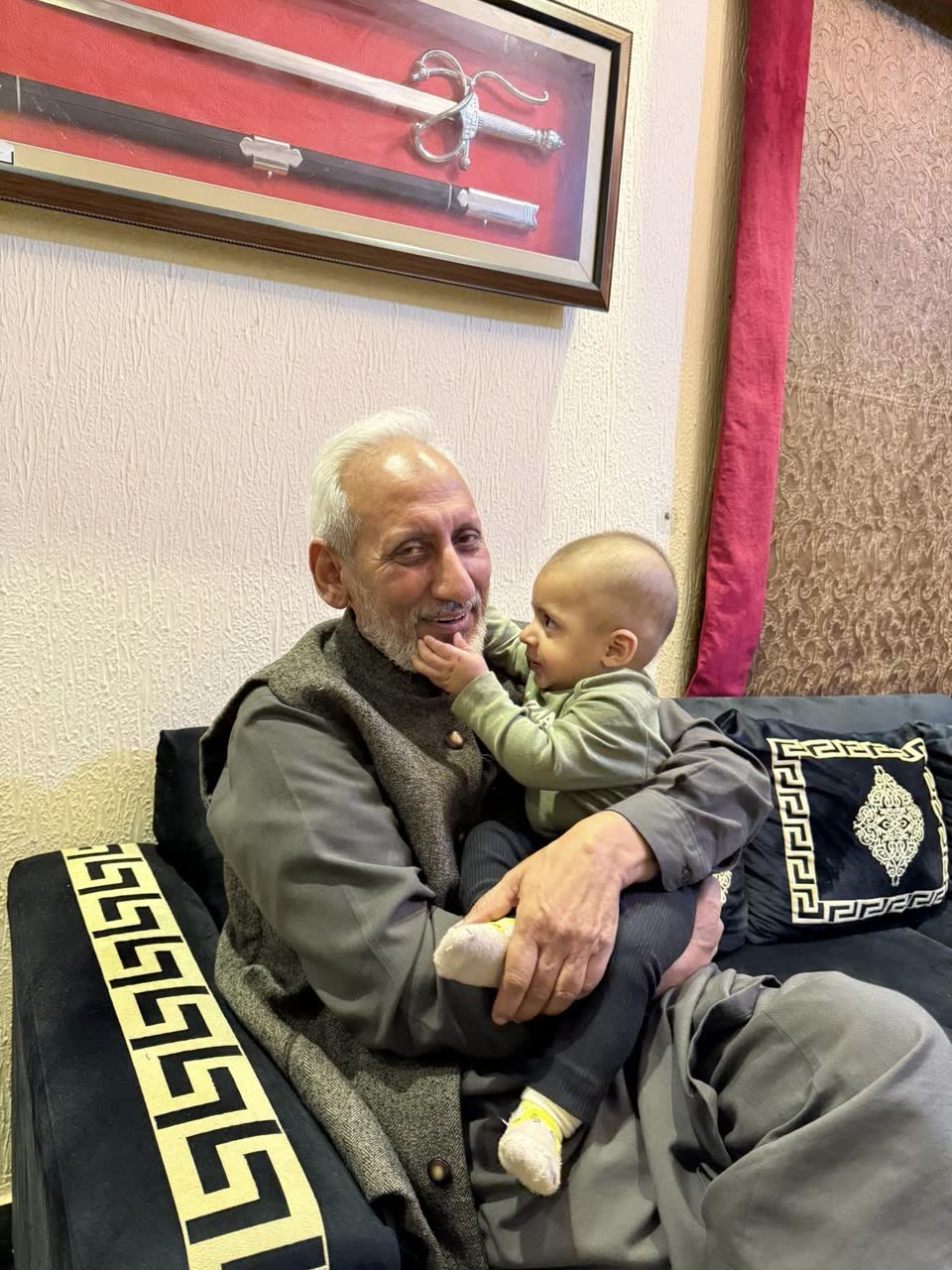 Umair's father holding Raahim in Lahore, December 2024